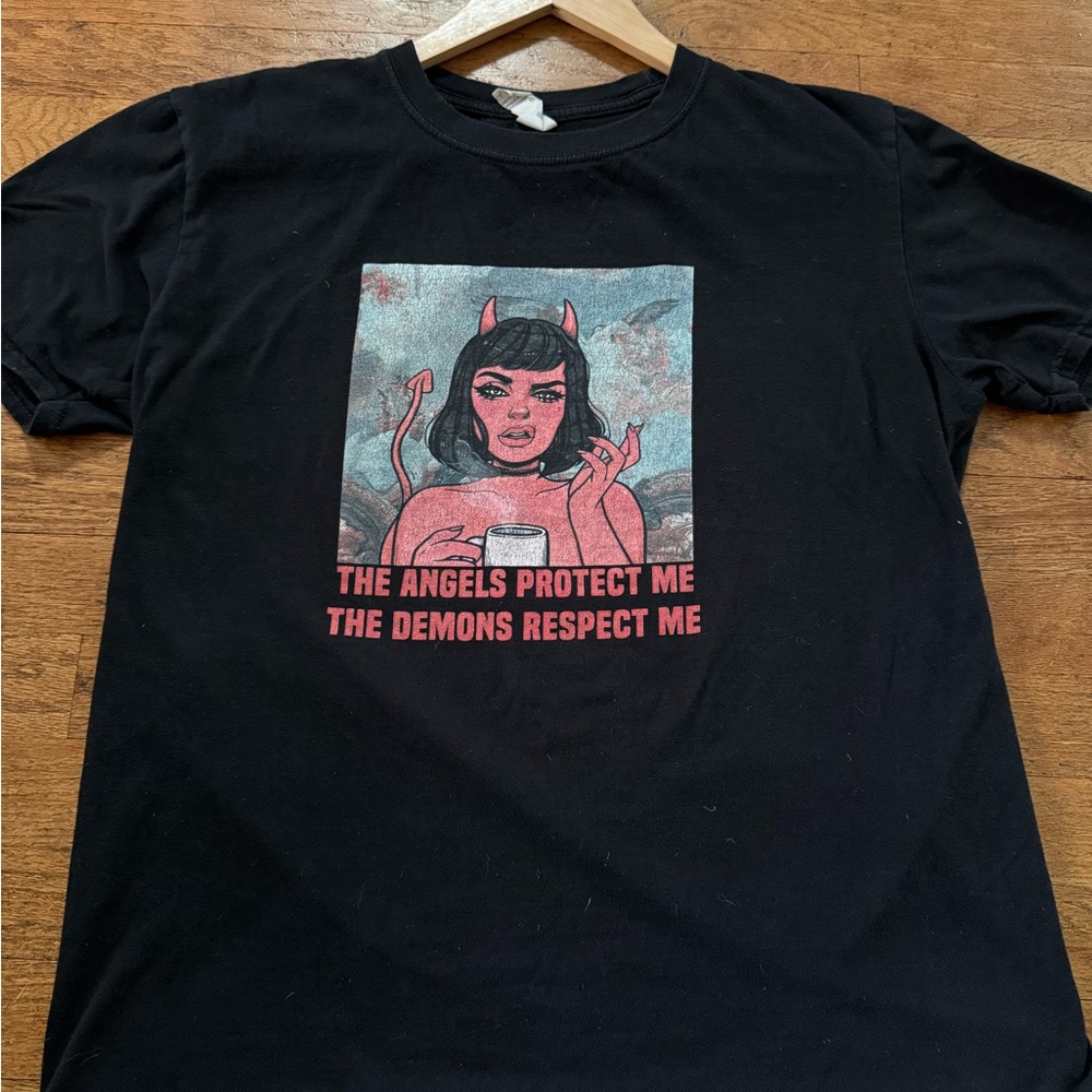 Black Graphic Tee with Red Design “The Angels protect me. The Demons respect me”